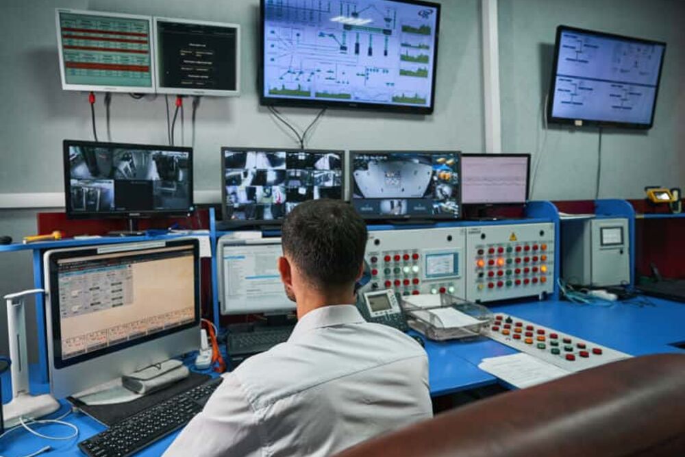 Data centre control room: an operator at the engineering systems console
